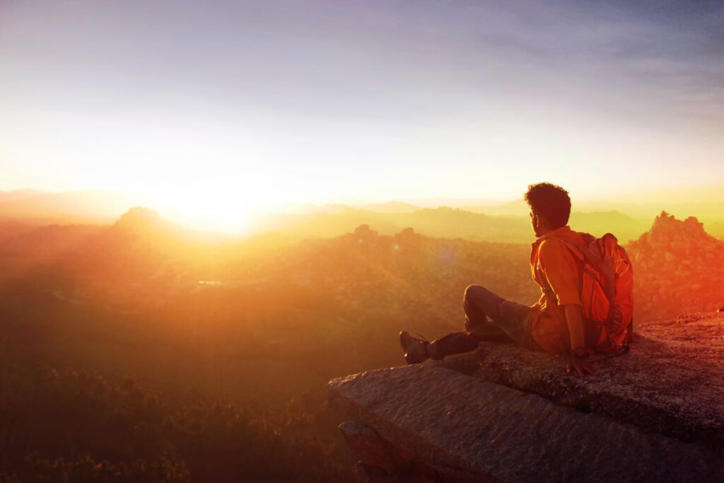 Solo hiker in a mountain summit adventure