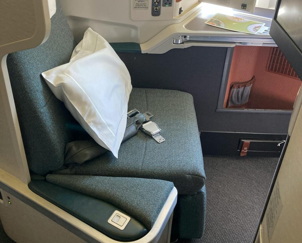 Business class seat inside a commercial airplane cabin