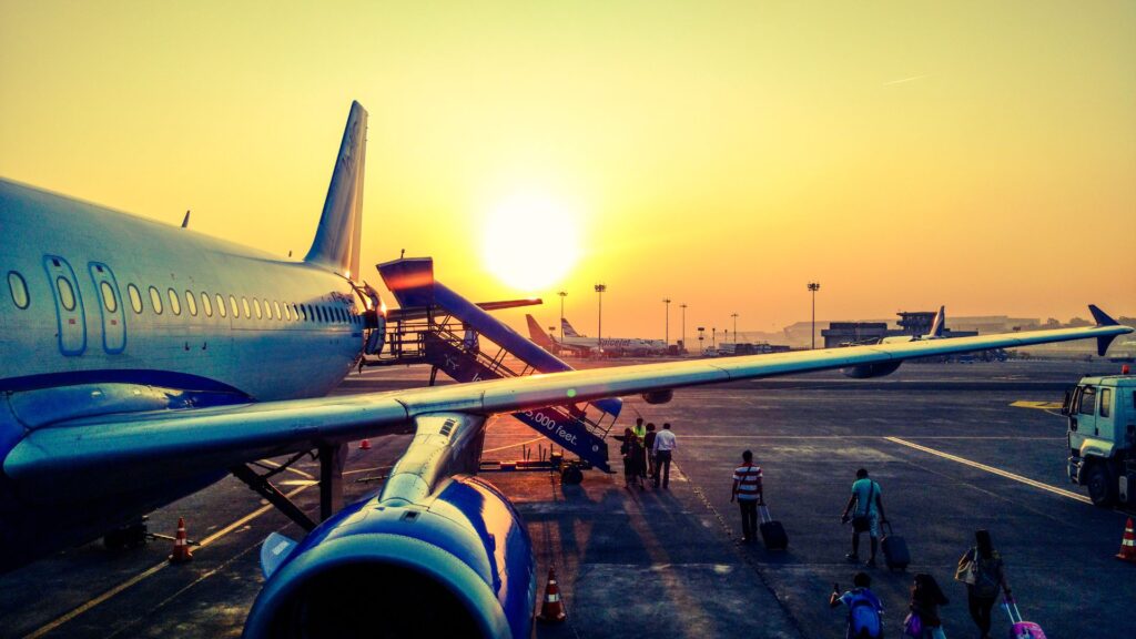 Passengers boarding a plane at the airport before departure