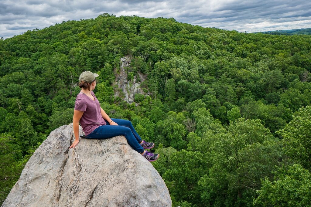 woman enjoying travel freedom in the mountains